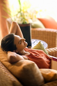A woman relaxing on the couch.