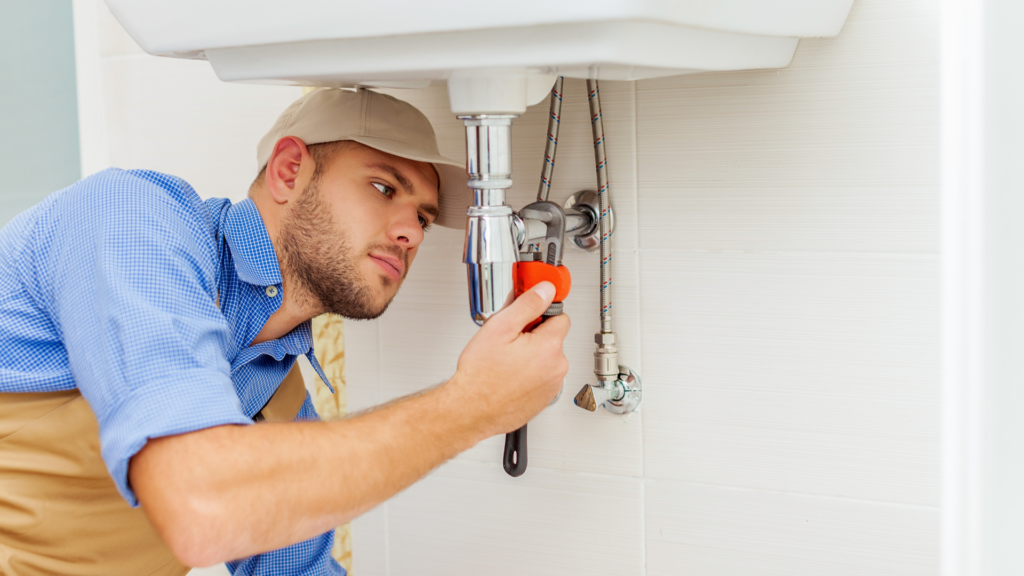 Plumber installing a sink