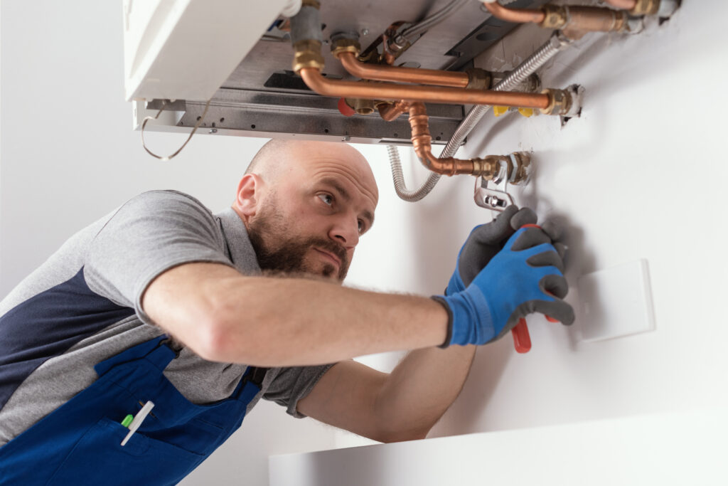 HVAC technician performing a boiler maintenance service